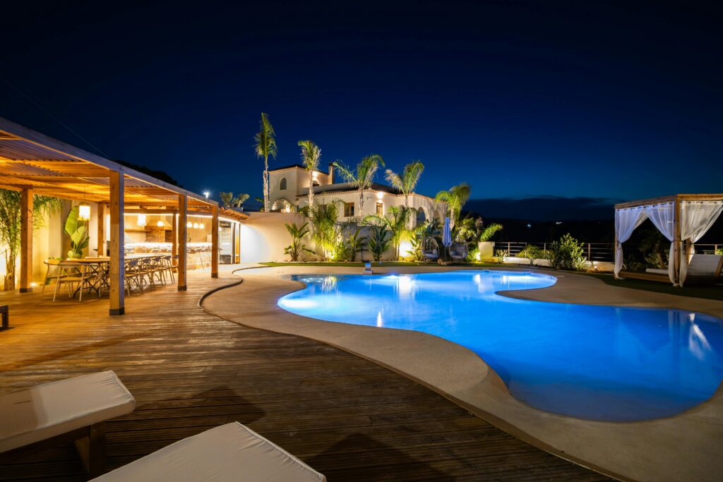 pexels-photo-33575697-33575697 Experience luxury in a Mediterranean villa poolside at night, perfect for relaxation.